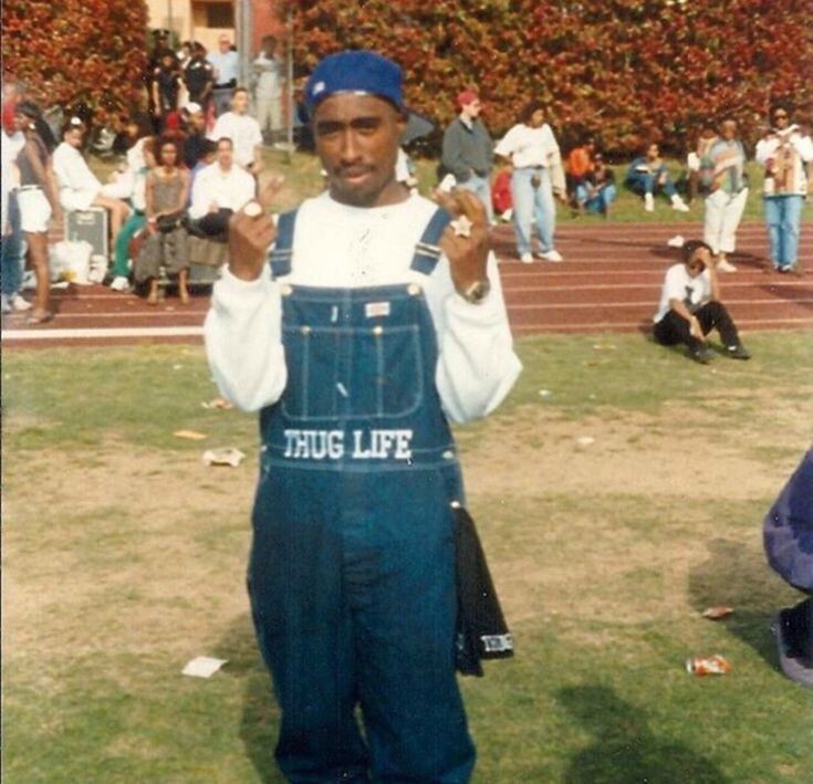 Tupac Shakur in Dickies commercial in red wood frame. Never before seen picture Tupac Shakur in Dickies commercial in red wood frame. Never before seen picture
