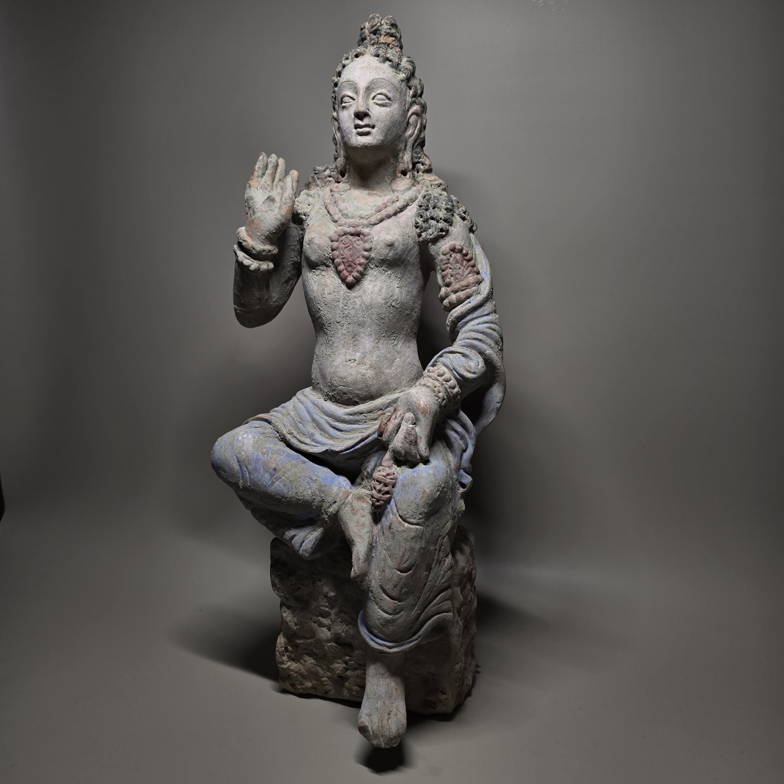 AN IMPORTANT AND BIG GANDHARA TERRACOTTA PAINTED SEATED BUDDHASATWA