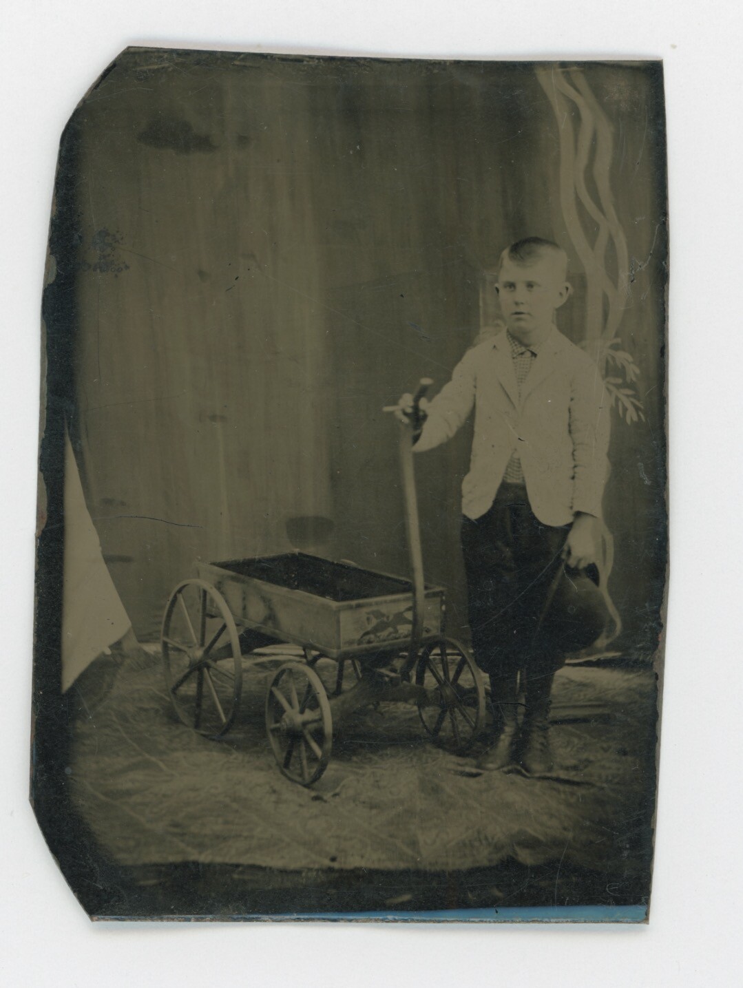 Ca. 1870s-1880s TINTYPE OF BOY & TOY WAGON WITH RUNNING HORSE PAINTED DECORATION Ca. 1870s-1880s TINTYPE OF BOY & TOY WAGON WITH RUNNING HORSE PAINTED DECORATION