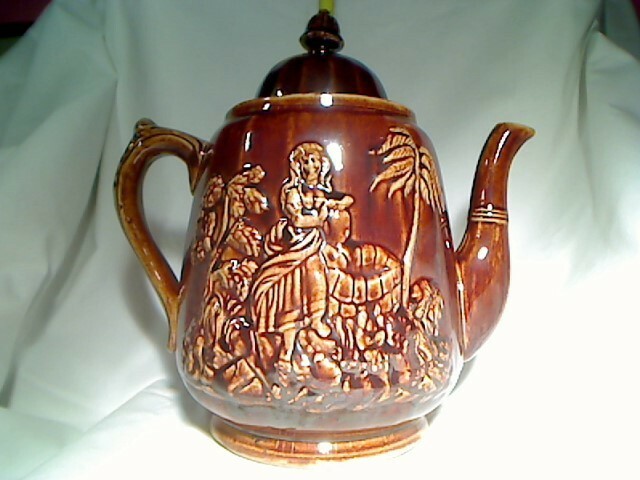 Rebekah/Rebecca at the well, teapot. Antique-Rockingham glaze Rebekah/Rebecca at the well, teapot. Antique-Rockingham glaze