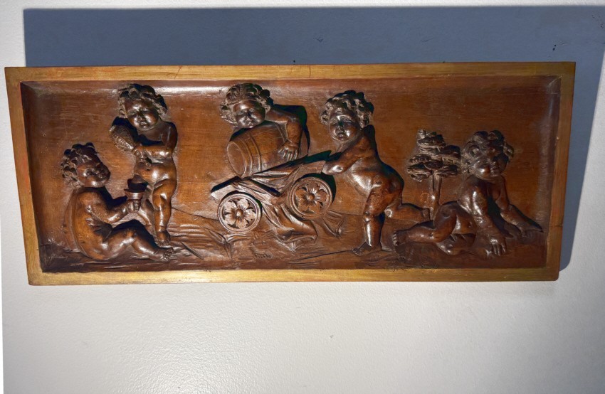 Authentic 17th century Renaissance period carved walnut panel depicting putti.