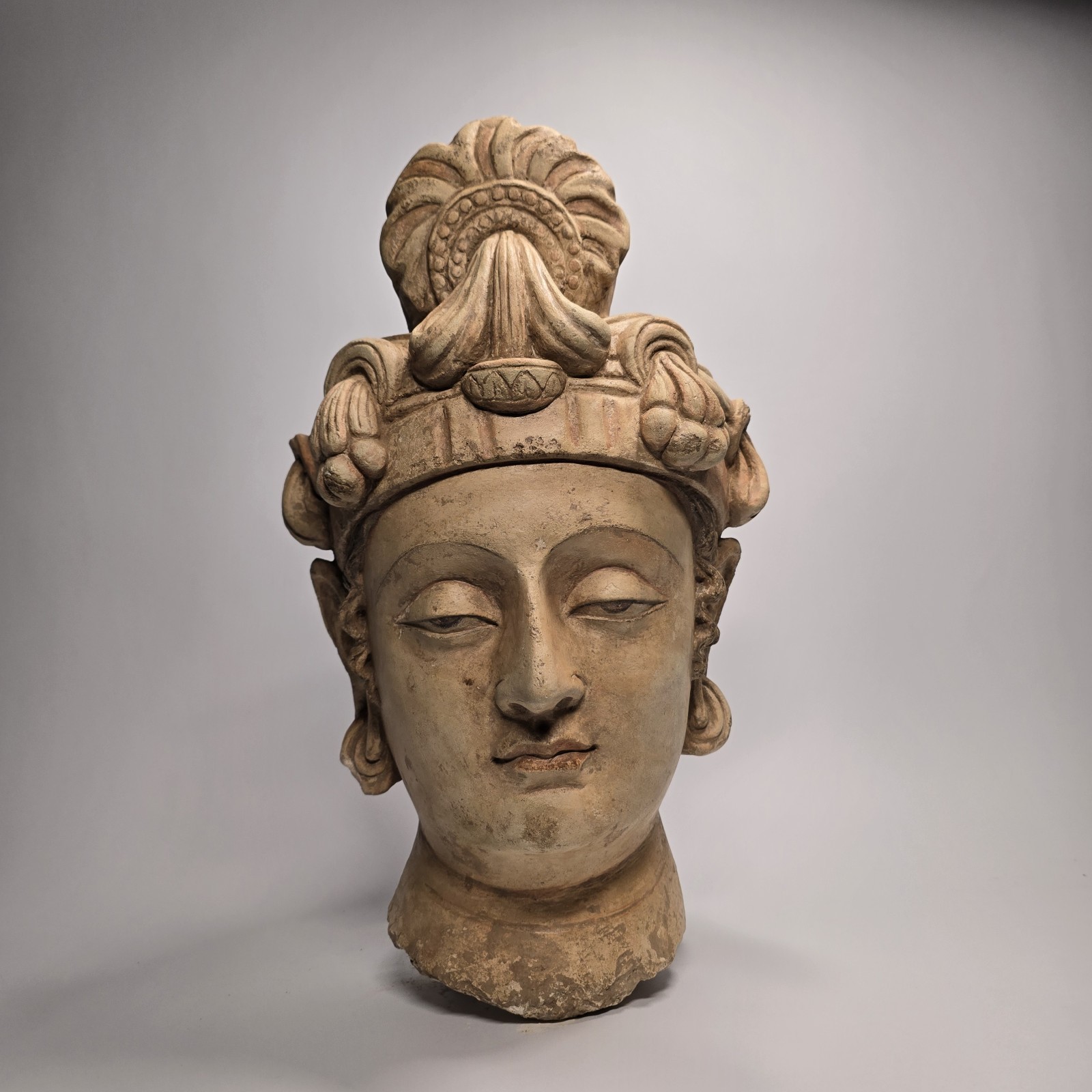 A VERY IMPORTANT AND BEAUTIFUL GANDHARA STUCCO PAINTED HEAD OF A BODHISATTVA. A VERY IMPORTANT AND BEAUTIFUL GANDHARA STUCCO PAINTED HEAD OF A BODHISATTVA.