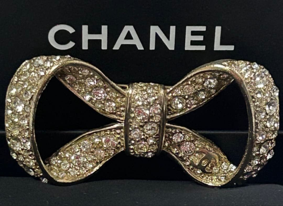 Chanel B12P Ribbon Rhinestone Gold Brooch 3x6cm Used