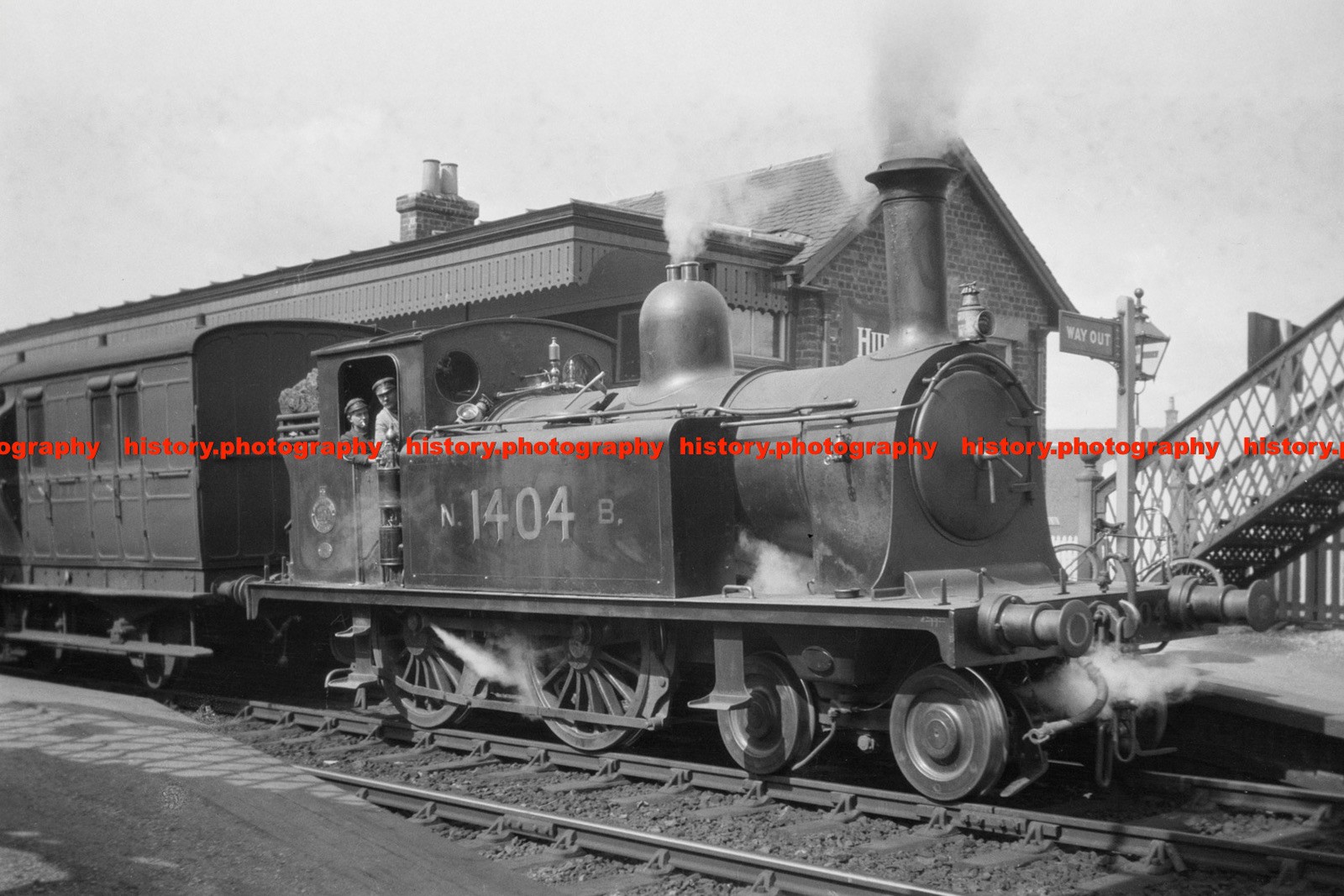 F021988 NBR locomotive Locomotive 4 4 0T No 1404 with passenger train GB 1900s