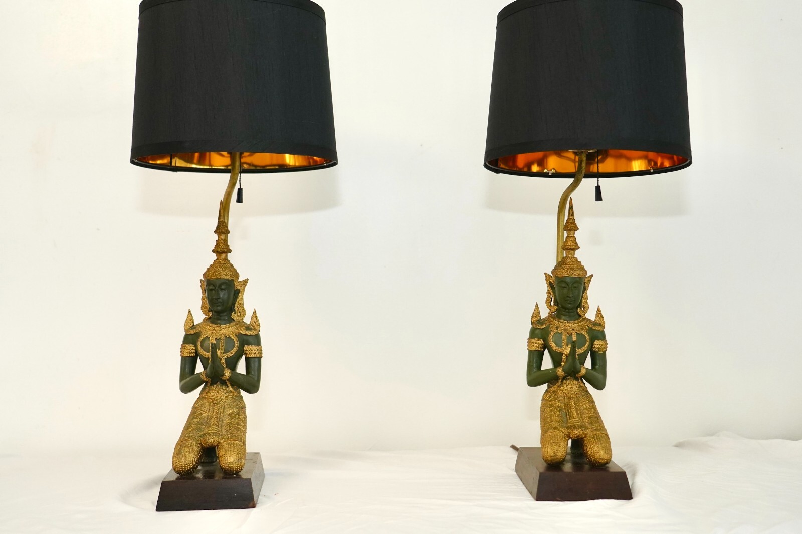 Pair of exquisite bronze Thai Teppanom kneeling angel Buddha table lamps. Pair of exquisite bronze Thai Teppanom kneeling angel Buddha table lamps.