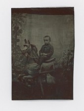 CIRCA 1870's-1880's TINTYPE OF A BOY RIDING ON A CAROUSEL HORSE, VERY RARE picture