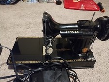 Singer feather weight Sewing Machine With Original Singer Sewing Needle Still On picture