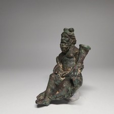 AN IMPORTANT ROMAN BRONZE STATUE OF A SEATED BEARD MAN HOLDING VESSEL. picture