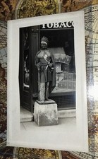 BEST RPPC OF CIGAR STORE INDIAN ON EBAY.  HE HAS A RIFLE BIG KNIFE 2 MEDALLIONS. picture