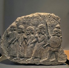 SCARCE HITTITE DIETY A LARGE STONE WALL FRAGMENT WITH STORY DEPICTING SOLDIERS. picture