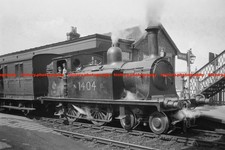 F021988 NBR locomotive Locomotive 4 4 0T No 1404 with passenger train GB 1900s picture